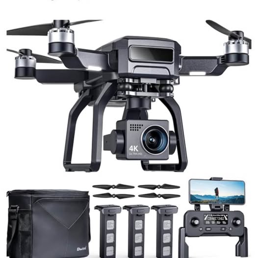 Foldable 4K camera drone with transmitter and spare batteries, side view