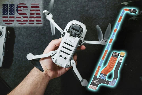 Foldable white quadcopter drone with front gimbal camera, held in hand