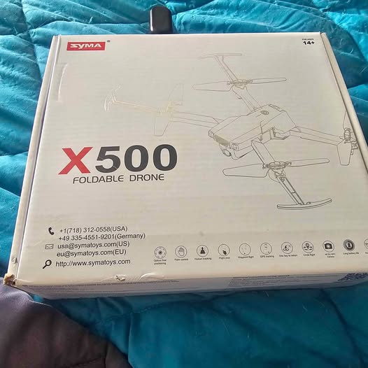 Syma X500 foldable drone retail box with product artwork and specs