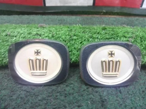 Diecast model wheel hub caps with crown emblem, dark blue-gray rims