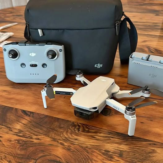 DJI Mini 2 Fly More drone kit with controller, propellers, and carrying bags