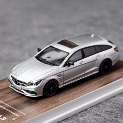 Silver 1:64 scale wagon diecast toy car, front three-quarter view with black wheels.