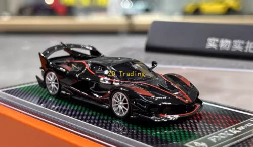 Black super racing sports diecast model car with orange decals on display base
