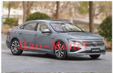 Diecast model car, dark gray 4-door sedan front three-quarter view