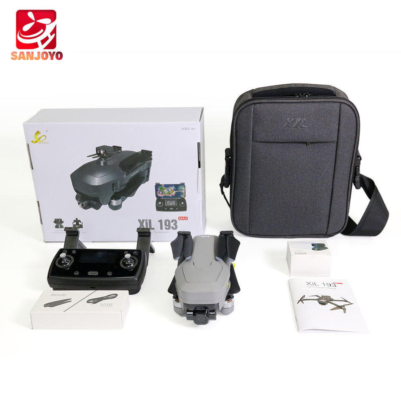 Drone kit with quadcopter, handheld controller, carrying case, manuals, and spare parts
