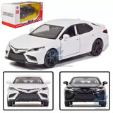 White alloy diecast model car in front three-quarter view, detailed grille and headlights