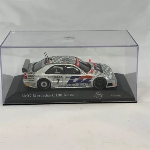 1:43 diecast race car model in box, white Mercedes AMG C180 with black and blue stripe