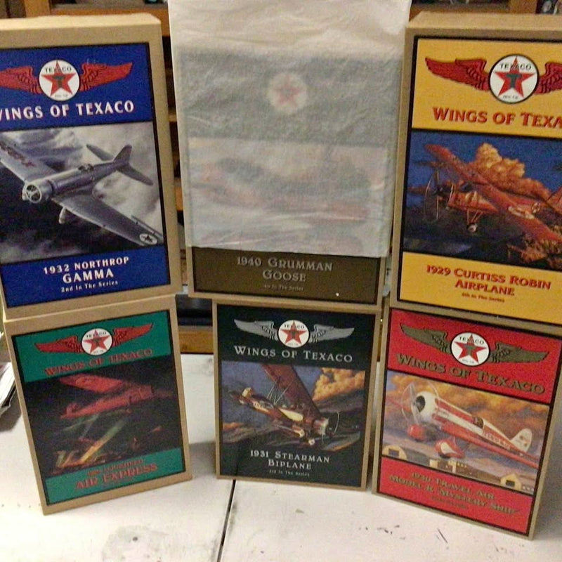 Diecast metal airplane set in display boxes with Wings of Texaco graphics