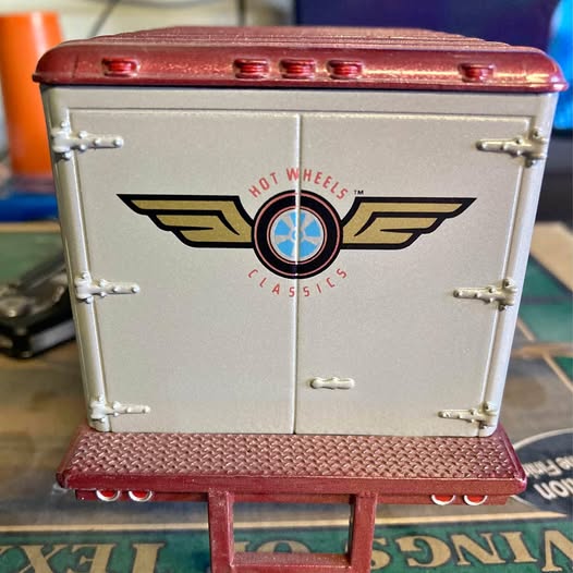 Diecast truck with Hot Wheels Classics logo, silver body and red roof