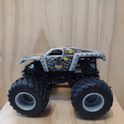 Gray and black monster truck diecast toy with oversized tires and lifted body