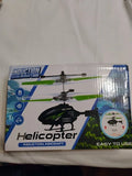 Mini induction helicopter toy drone in retail box, black with green accents