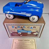 Blue diecast pedal car with Pedal Vehicles authenticity certificate and box
