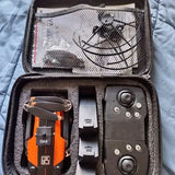 GPS quadcopter drone in a padded carrying case, with controller and accessories