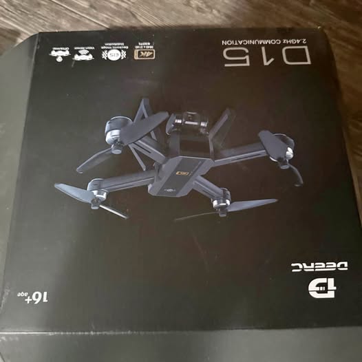 Drone retail box with printed gray quadcopter illustration, black design