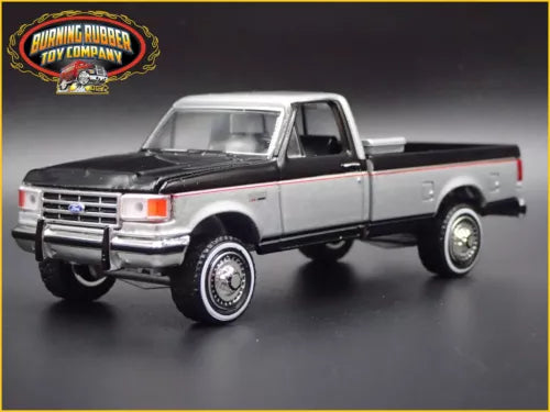 Silver and black 1:64 scale diecast pickup truck model, front three-quarter view.