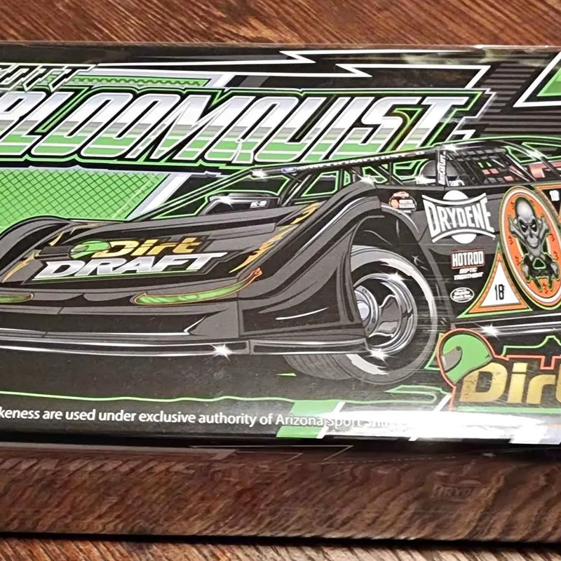 Diecast race car model in box, green and black sprint car design