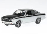 Diecast model car, black hood and silver body, front 3/4 view with chrome grille