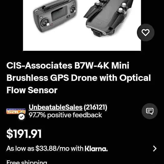 Compact grey drone controller with screen and compact drone body
