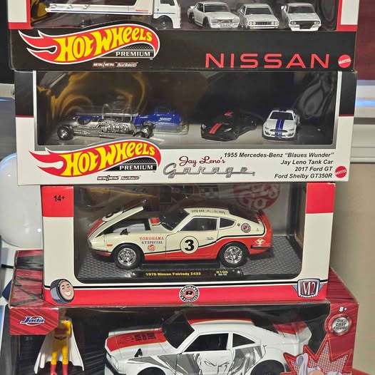 Hot Wheels Premium diecast cars in blister box, Nissan and garage graphics