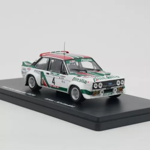 Diecast rally car model, white with green and red stripes, number 4, on display base