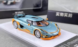 Ice blue diecast racing sports car toy with orange accents, front three-quarter view