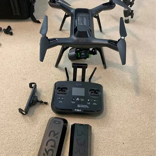 Foldable drone with remote controller and phone mount