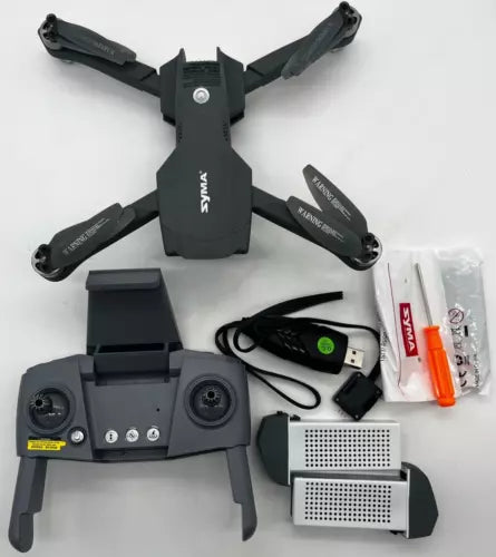 Black GPS drone with 4K camera, folded propellers, remote controller and accessories