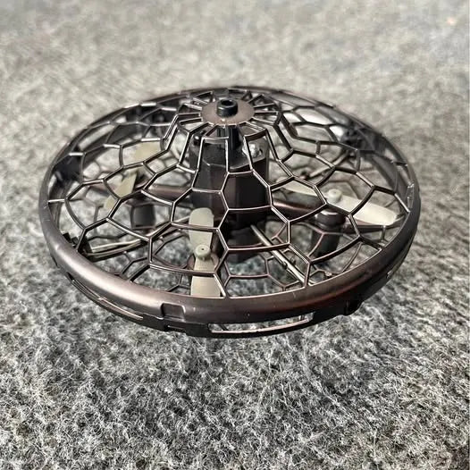 Small rechargeable drone with hexagonal mesh body and central prop hub