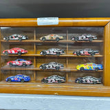 Wooden diecast display case with multiple race cars, glass shelves
