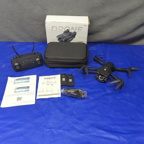Folding FPV drone kit with remote controller, manuals, and carrying case