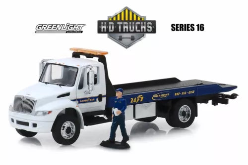 Diecast flatbed truck with serviceman figure, white cab and blue flatbed