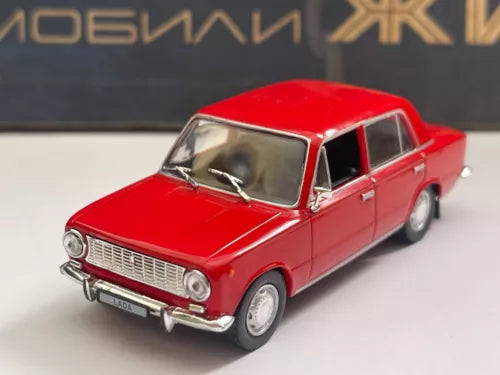 Red 1:43 diecast sedan model car, front three-quarter view
