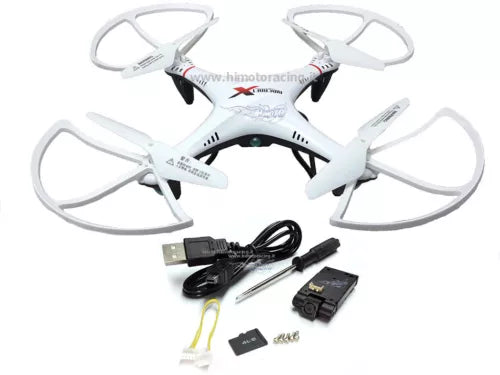 White quadcopter drone with four propeller arms, plus USB cable and battery pack