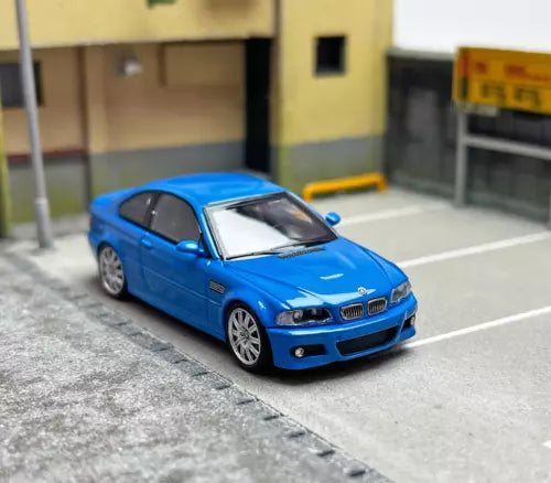 Blue racing coupe diecast metal car toy with front grille and headlights visible