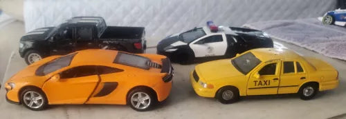 Diecast model car set: orange sports car and yellow taxi sedan, 1:36 scale