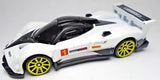 White diecast race car with black cockpit, yellow rims, and red number 1 on door