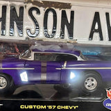 Hot Wheels vintage diecast car in purple with silver stripes, black base: CUSTOM '57 CHEVY'.