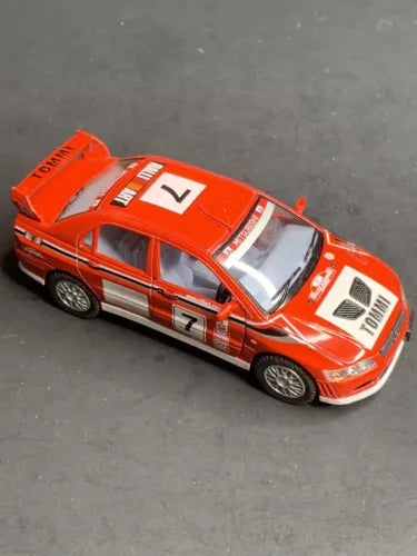 Orange diecast toy car model, Mitsubishi Lancer Evolution VII, 1/36 scale