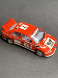 Orange diecast toy car model, Mitsubishi Lancer Evolution VII, 1/36 scale