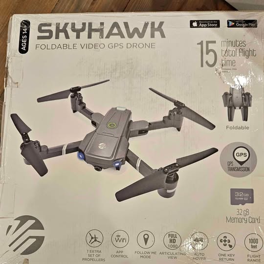 Foldable GPS drone with gray body and four extended propellers