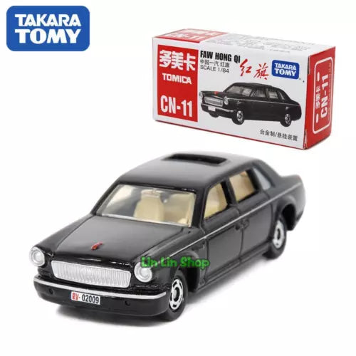 Tomica diecast model car, black sedan with chrome grille, front 3/4 view