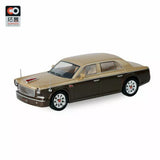 1:64 diecast model car in gold and dark brown with chrome details and white tires