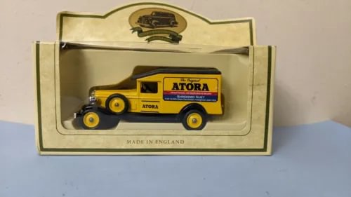 Yellow ATORA diecast model van in display box, with crown logo, Made in England