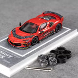 Red 1/64 scale diecast sports car model with black wheels and side details