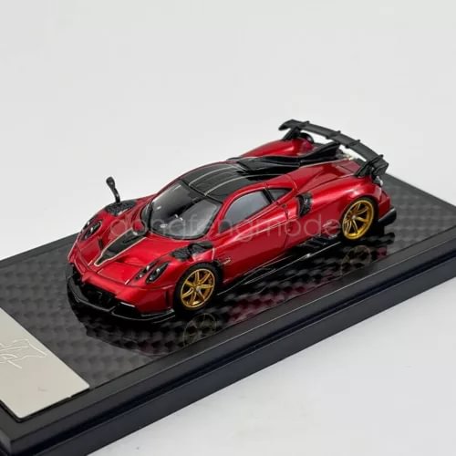 Red 1/64 scale Pagani Imola diecast sports car model with black spoiler