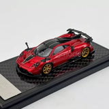 Red 1/64 scale Pagani Imola diecast sports car model with black spoiler
