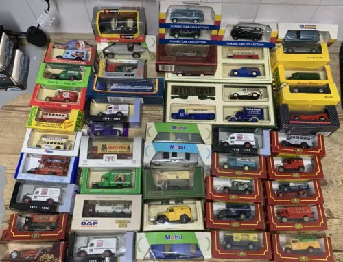 Mixed diecast model car job lot in display boxes, assorted colors and styles