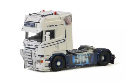 White diecast model truck with chrome grille, black wheels, and blue cab details