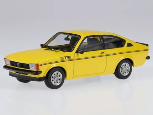 Yellow diecast coupe model car with ST/E stripe and silver wheels, 3/4 front view