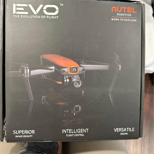 EVO drone box showing illustrated quadcopter with orange body and branding